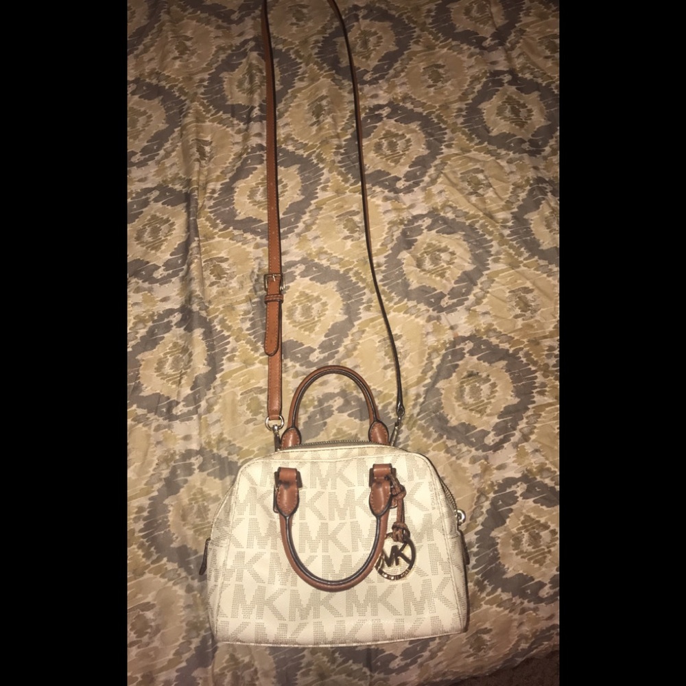 Michael Kors purse inside shows a little wear.